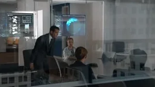 man giving presentation to group in office — Suits