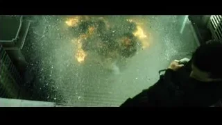 person watching large explosion in city — The Matrix