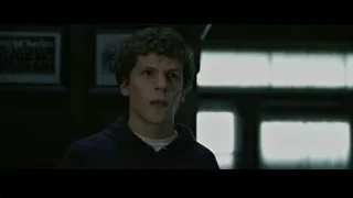 young man in hoodie by window — The Social Network
