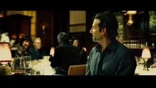 Man with serious expression at restaurant table — Limitless