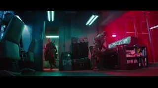 Man with gun in dark control room — Deadpool 2