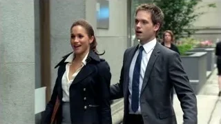 three people conversing outside building — Suits