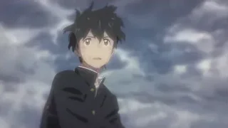 Young man in black suit under cloudy sky — Weathering with You