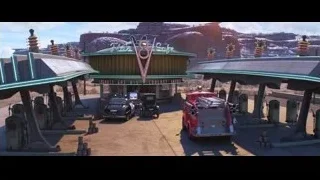 futuristic gas station in desert — Cars 3