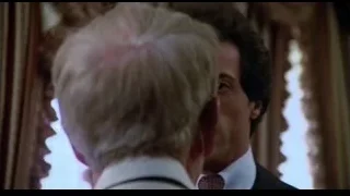 man in suit looking at camera — Rocky III