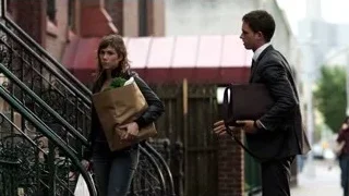 Man kissing woman on city street — Suits