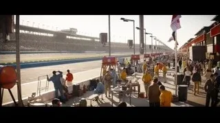 large crowd at race track — Ford v Ferrari