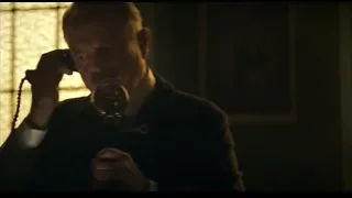 Man in suit in front of stained glass window — Peaky Blinders