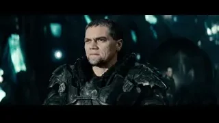 Person lying in distress on rocky surface — Superman: Man of Steel
