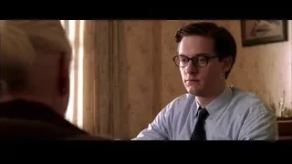Young man sitting in room looking off to side — Spider Man 2
