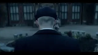man standing with back to dilapidated building — Peaky Blinders