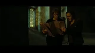 man reading book, woman watching in dim room — Harry Potter and the Deathly Hallows 2