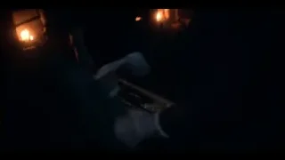 man in suit holding gun in dimly lit room — Peaky Blinders