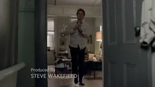 man walking through living room doorway — Suits