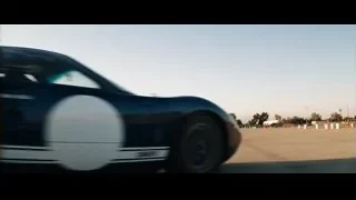 Black sports car on race track — Ford v Ferrari