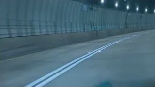Lamborghini sports car driving through tunnel at night — Sports Cars