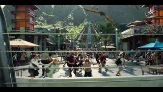 busy theme park street with pyramid building — Jurassic World