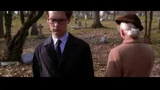 Man and elderly woman conversing in cemetery — Spider Man 2