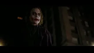 Joker holding bat in dark alleyway — Batman: The Dark Knight