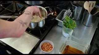 person pouring liquid in kitchen — The Bear