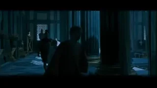 Person walking in grand columned room — Gladiator 2