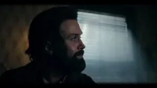man with beard looking out window — Peaky Blinders