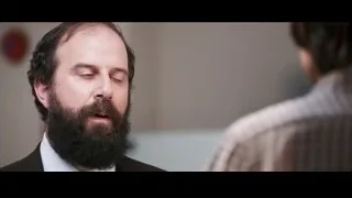 Man with beard in suit looking at camera — Jobs
