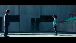man walking with briefcase in empty stadium — The Karate Kid