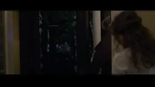 man and woman looking out window — The Amazing Spider Man