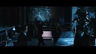 Dimly lit control room with monitors — Iron Man