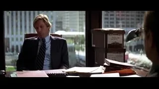 Man in suit at office desk, city view — Batman: The Dark Knight