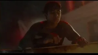 young man sitting on bench in dimly lit room — Life of Pi