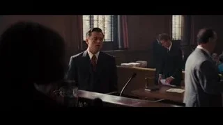 Man in suit speaking in courtroom — The Wolf Of Wall Street