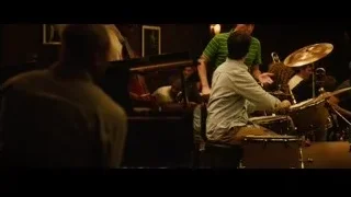 musicians playing in dimly lit room — Whiplash