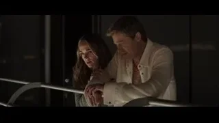 man and woman on balcony at night — F1
