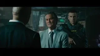 Three men conversing in dark futuristic room — Furious Seven