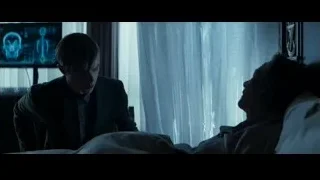 man in suit by window with X-ray on screen — The Amazing Spider Man 2