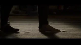 Person's feet on carpet with paper — The Amazing Spider Man
