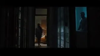 man silhouette looking out bedroom window — Creed 2