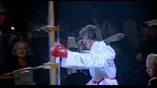 man in white robe in boxing ring — Rocky III