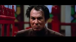 older man's serious face in suit — Bruce Lee: Enter The Dragon