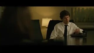 young man sitting at office desk with laptop — The Social Network