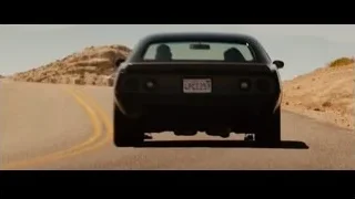 black car driving on desert road — Furious Seven
