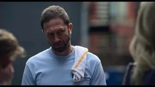 man with beard talking on urban street — The Bear
