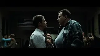 Two men conversing in dimly lit room with American flag — Fight Club