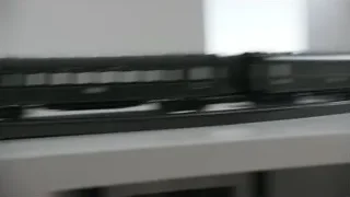 man laughing at desk with model train — Elon Musk: Return to Space
