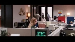 woman at desk in office cubicle — Jobs