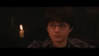 young boy looking at camera with candle — Harry Potter and the Philosophers Stone