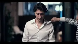 woman adjusting man's shirt collar — The Social Dilemma