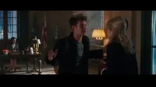 Man and woman standing in room with window — The Amazing Spider Man 2